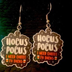 Cute hocus pocus silver tone earrings that says I need coffee to focus